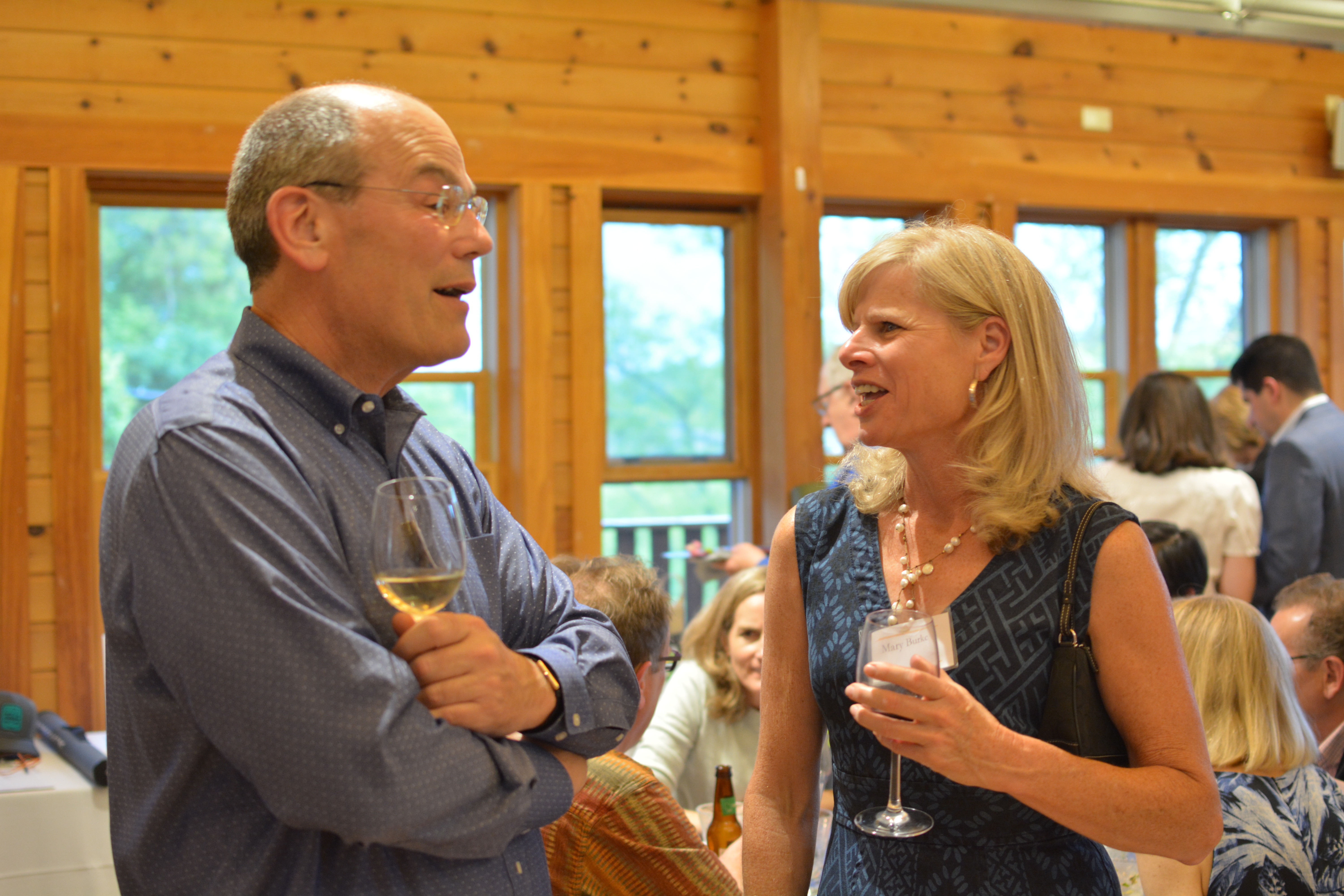 Mary Burke speaks with a fellow UEC Patron at the Summer Solstice Soiree