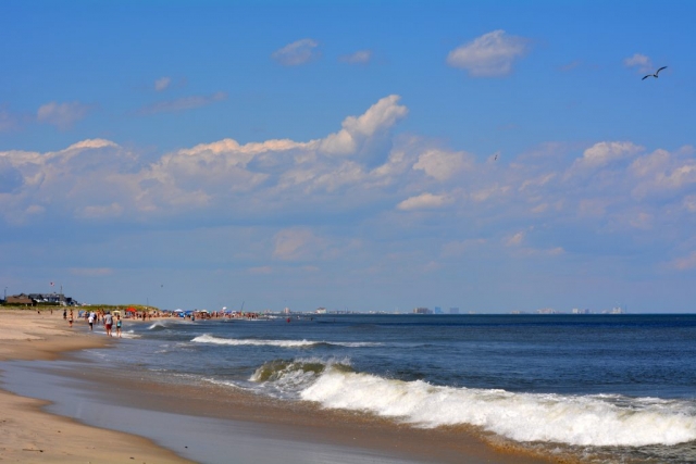 The view of a busy shore with Atlantic City in the background
