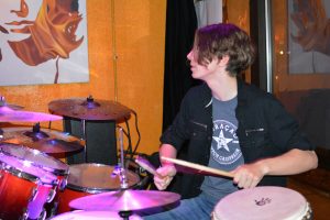 Max Bird plays the drum kit at Fire on Water