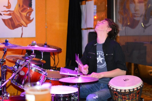 Max Bird plays the drum kit